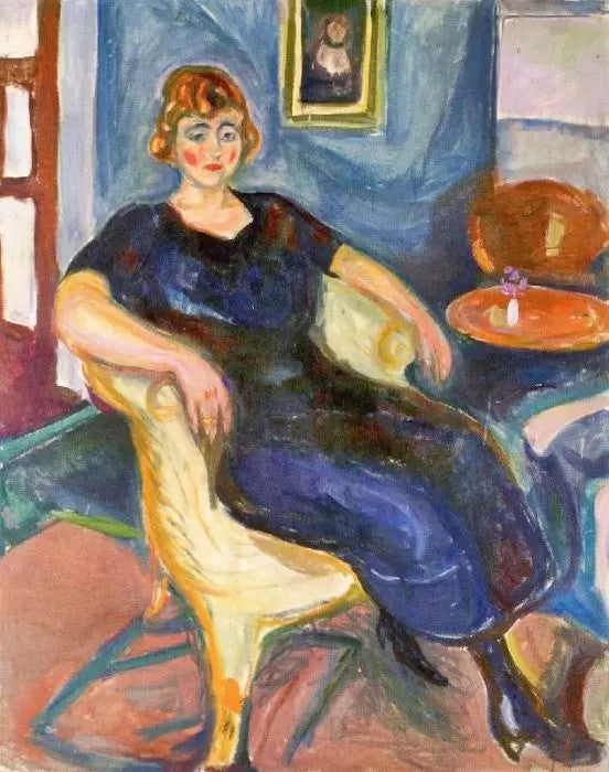 MODEL IN WICKER CHAIR