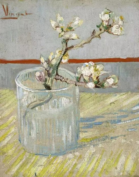 BLOSSOMING ALMOND BRANCH IN A GLASS