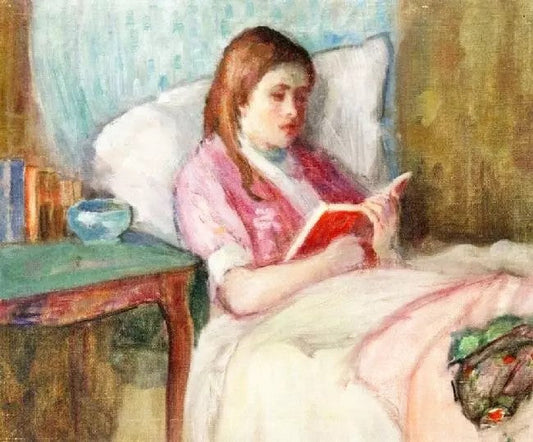YOUNG WOMAN READING IN BED