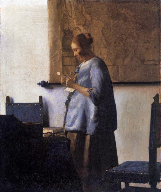 Woman In Blue Reading A Letter by Johannes Vermeer