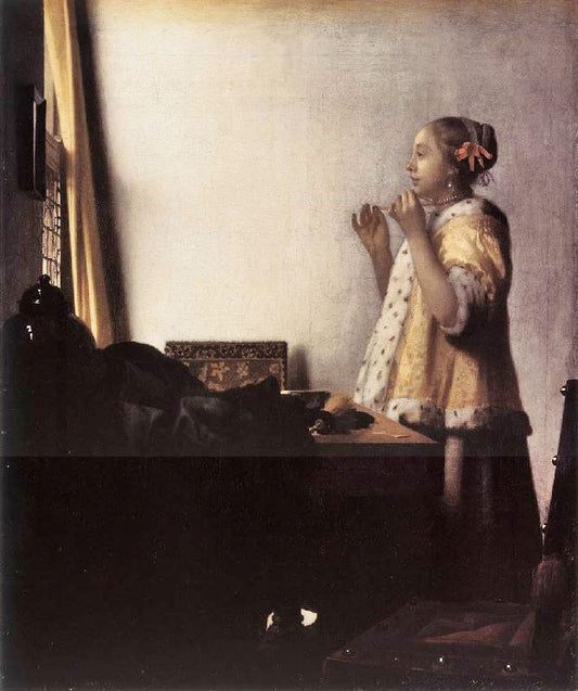 Woman With A Pearl Necklace by Johannes Vermeer