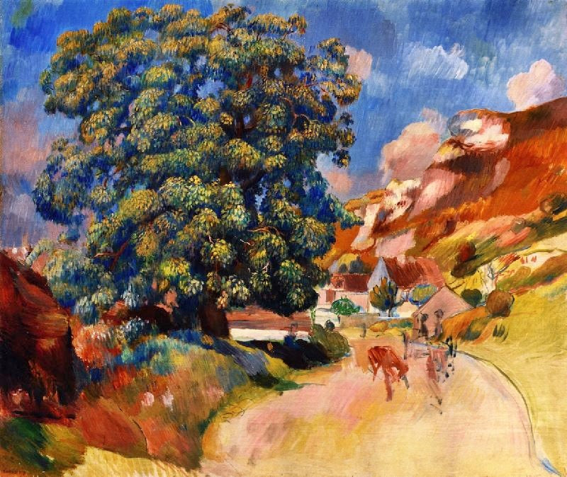 A LARGE TREE BY THE ROAD
