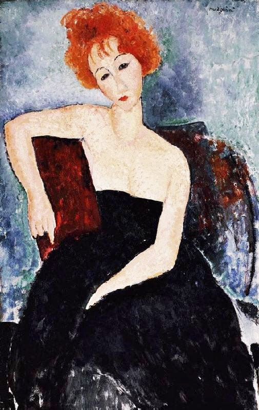 YOUNG REDHEAD IN AN EVENING DRESS