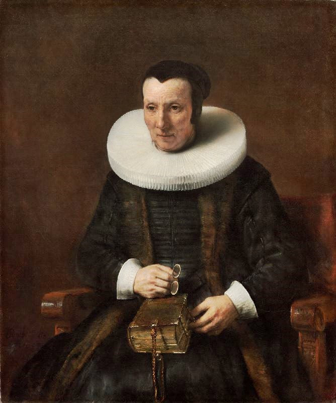 An Old Lady With A Book by Rembrandt van Rijn