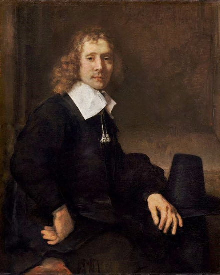 A Young Man Seated At A Table, Possibly Govaert Flinck by Rembrandt van Rijn