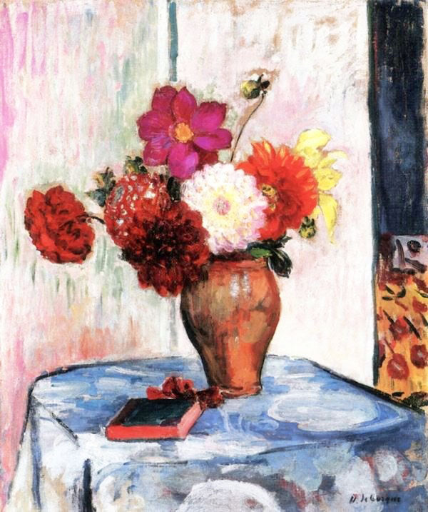 VASE OF DAHLIAS WITH BOOK ON A TABLE