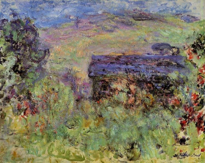 THE HOUSE SEEN THROUGH THE ROSES