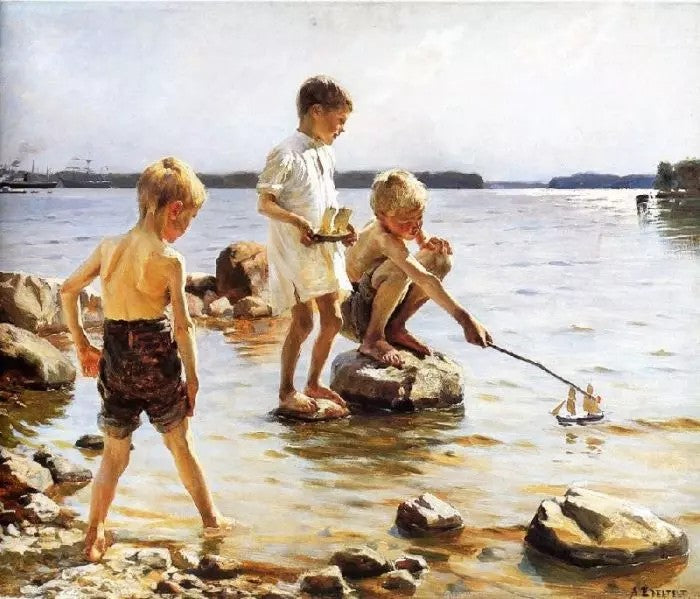 BOYS PLAYING AT THE BEACH