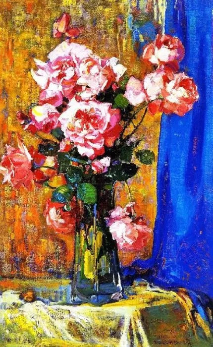 ROSES IN A ATALL GLASS