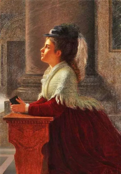 YOUNG WOMAN PRAYING IN THE CHURCH