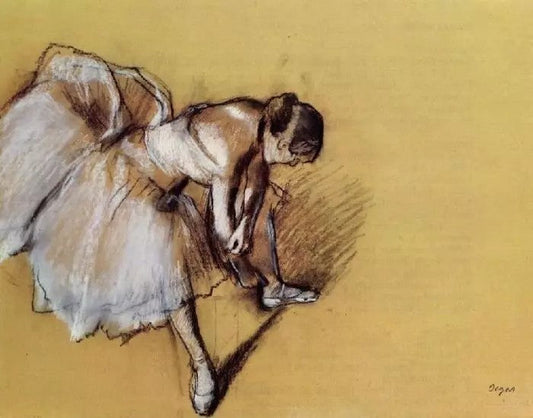 DANCER ADJUSTING HER SLIPPER