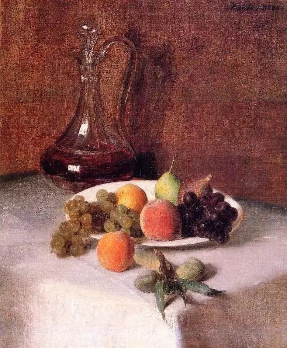 A CARAFE OF WINE AND PLATE OF FRUIT ON A WHITE TABLECLOTH