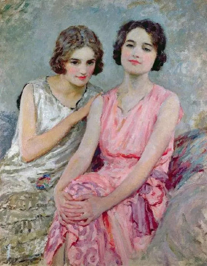 TWO YOUNG WOMEN SEATED