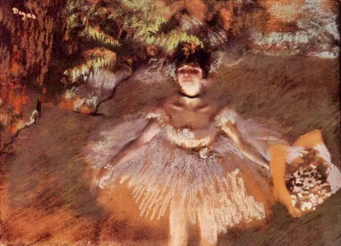 DANCER ONSTAGE WITH A BOUQUET