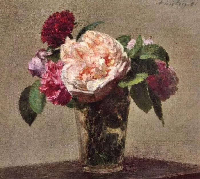 TEA ROSES AND RED ROSES IN A GLASS