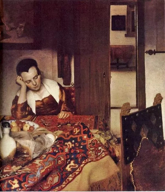 A WOMAN ASLEEP AT TABLE